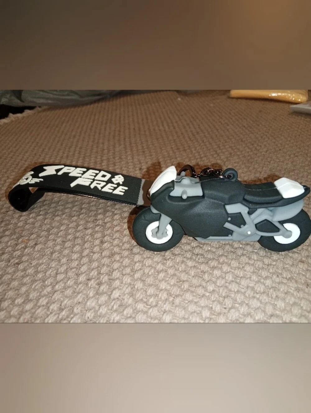 Black & Gray Motorcycle Keychain Toy with 'Speed & Free' Tag